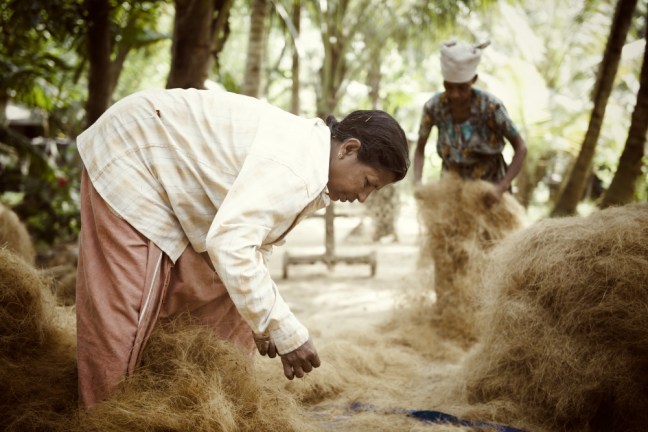 Making rope from coconut fibres. Munroe Island. Ashtamudi lake, Kollam, India. November 2013